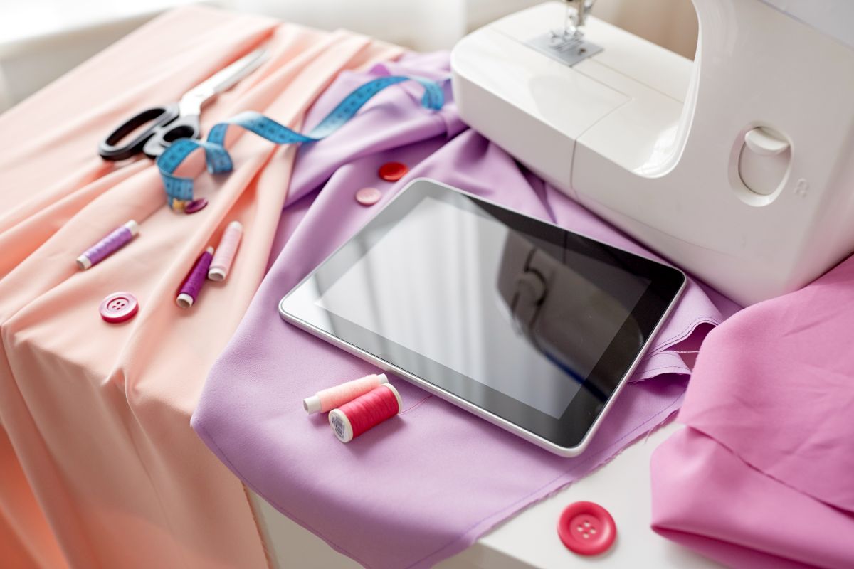 using a tablet to get online sewing lessons