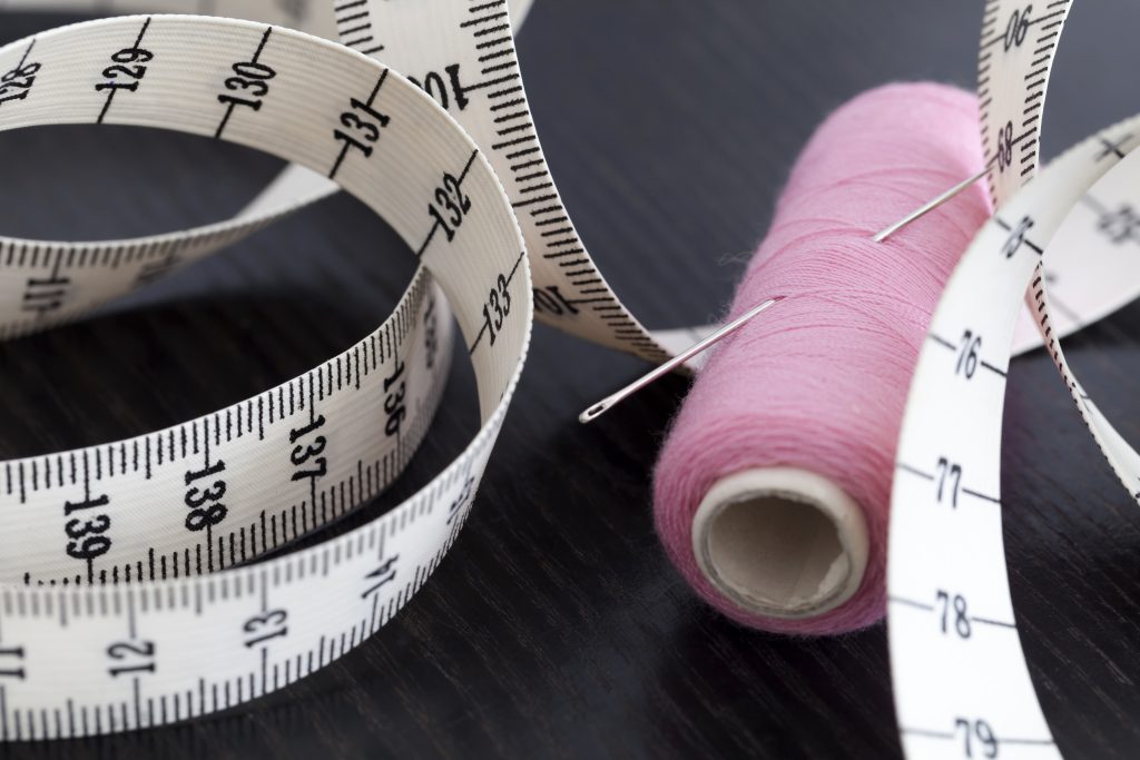 Measuring tape and sewing needle